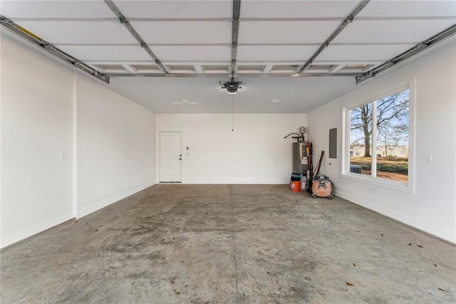 garage with a garage door opener, electric panel, and water heater