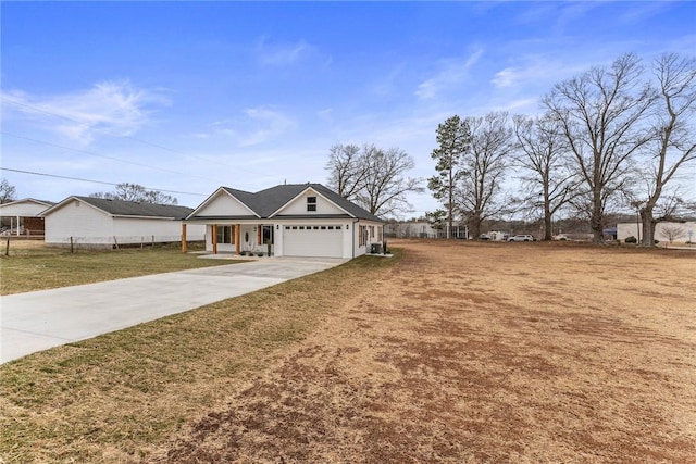 view of front of home with a garage and a front lawn