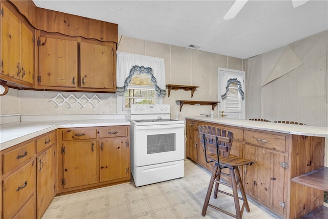 kitchen featuring white electric stove