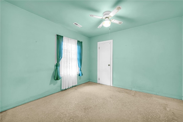 carpeted empty room with ceiling fan