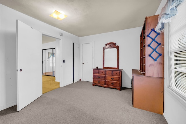 bedroom with light carpet