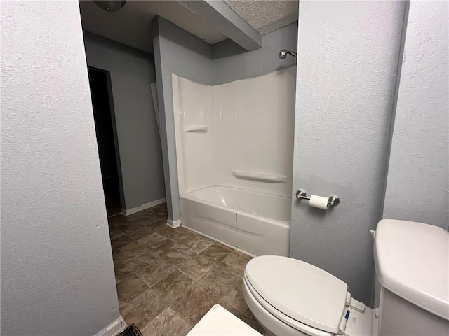 bathroom featuring  shower combination and toilet