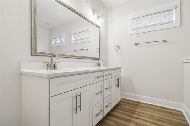 bathroom featuring vanity and hardwood / wood-style flooring