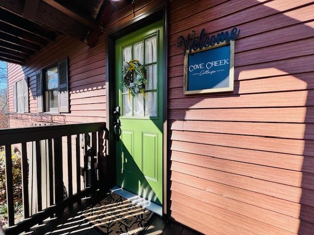 view of exterior entry featuring a porch