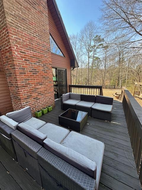 deck featuring outdoor lounge area