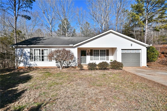 ranch-style home with a garage and a front yard