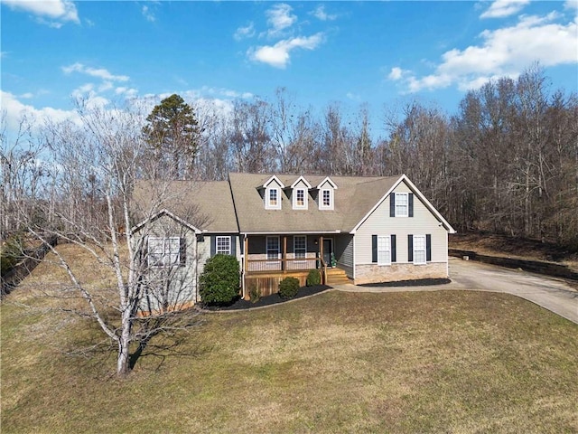 cape cod-style house with a porch and a front lawn