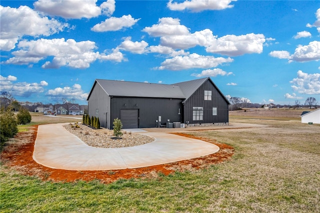 view of home's exterior featuring a yard and a garage