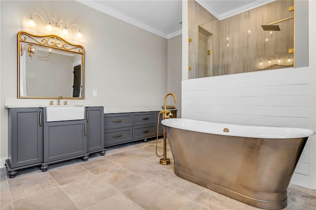 bathroom with vanity, ornamental molding, and independent shower and bath