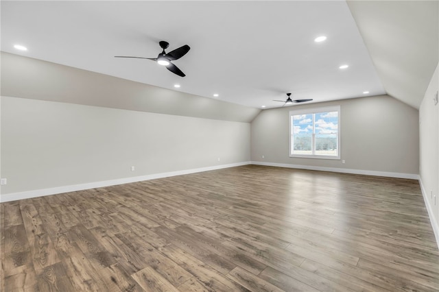 bonus room featuring hardwood / wood-style flooring, ceiling fan, and vaulted ceiling