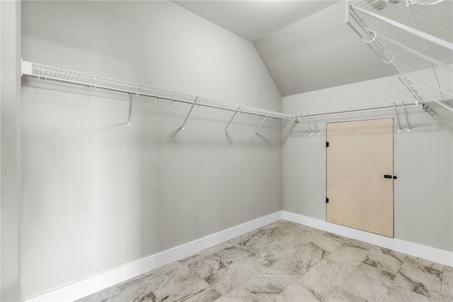 spacious closet with lofted ceiling