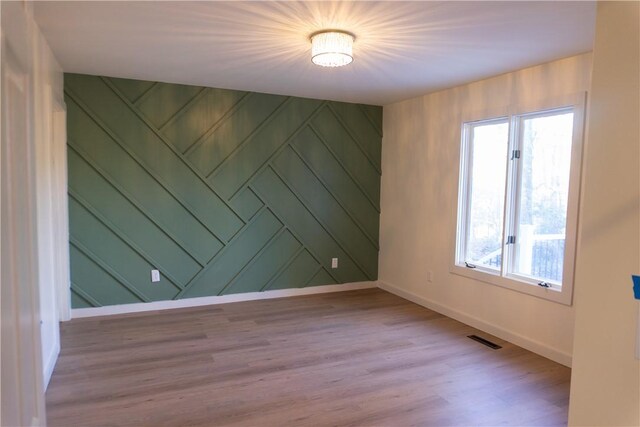 empty room featuring light hardwood / wood-style floors