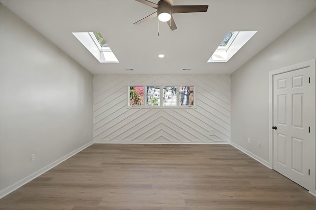 24 Mainsail Dr, Salem, SC 29676 - spare room with vaulted ceiling with skylight, wood finished floors, and wood walls