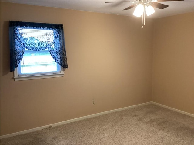 empty room with carpet floors and ceiling fan