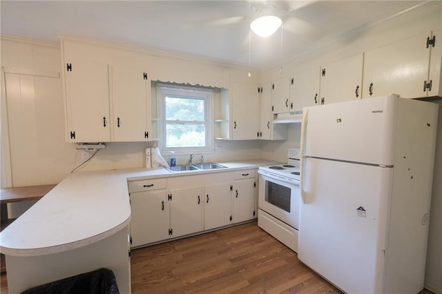 kitchen featuring sink, light wood-type flooring, ornamental molding, white appliances, and white cabinets