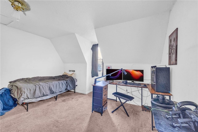 bedroom with lofted ceiling, light colored carpet, and a textured ceiling