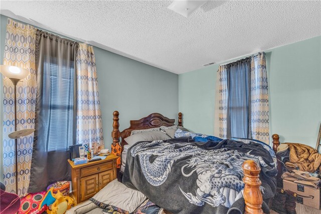 bedroom featuring a textured ceiling