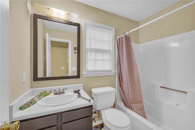 full bathroom featuring vanity, shower / tub combo with curtain, and toilet