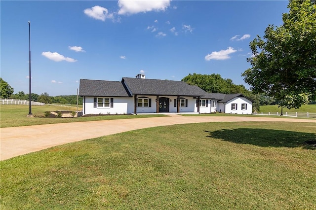 ranch-style home with a front lawn