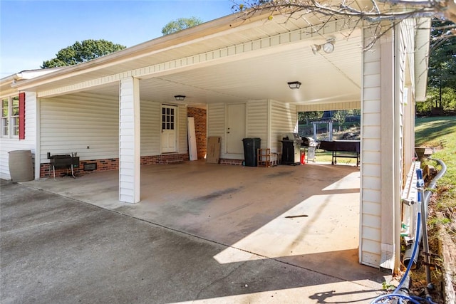 view of patio with a carport and area for grilling