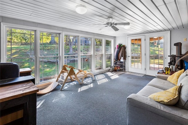 sunroom featuring wooden ceiling and ceiling fan