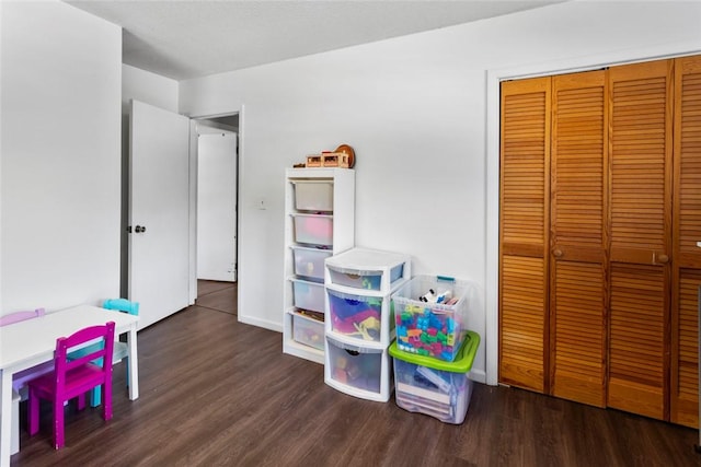 recreation room featuring dark hardwood / wood-style flooring