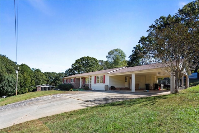 ranch-style home with a front lawn and a carport