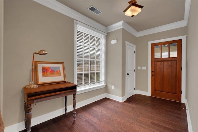 foyer entrance featuring crown molding, a wealth of natural light, and dark hardwood / wood-style floors