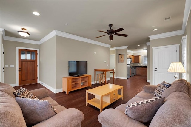 living room with dark wood-type flooring, ceiling fan, and ornamental molding