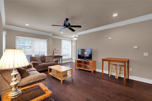 living room with crown molding, dark wood-type flooring, and ceiling fan