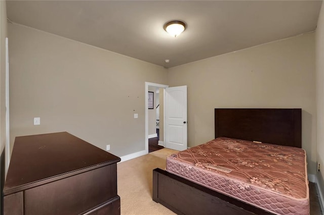 bedroom featuring light colored carpet