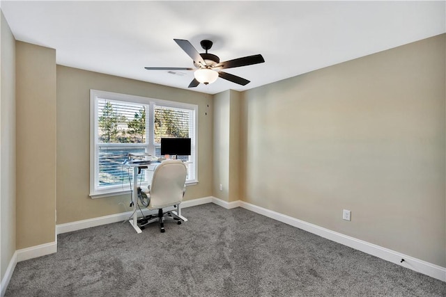 unfurnished office featuring carpet and ceiling fan