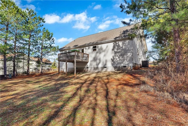 rear view of house featuring cooling unit and a deck