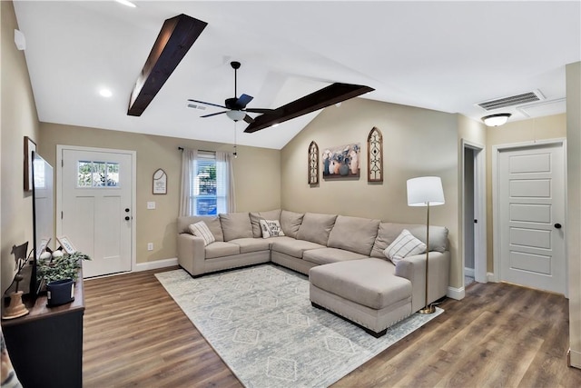 living room featuring hardwood / wood-style flooring, lofted ceiling with beams, and ceiling fan