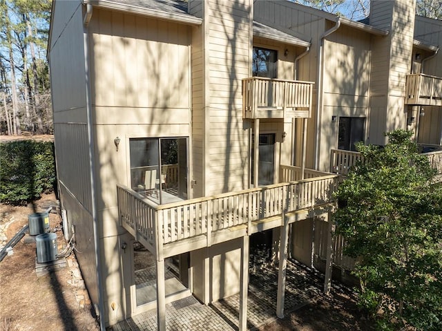 back of property featuring a balcony