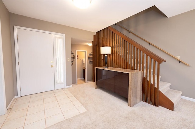 foyer entrance featuring light colored carpet