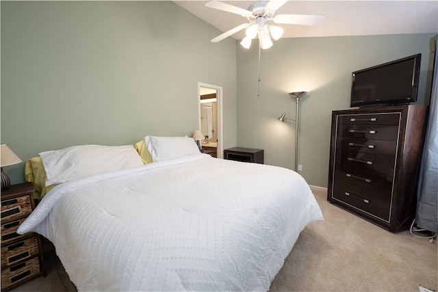 bedroom featuring vaulted ceiling, light colored carpet, and ceiling fan