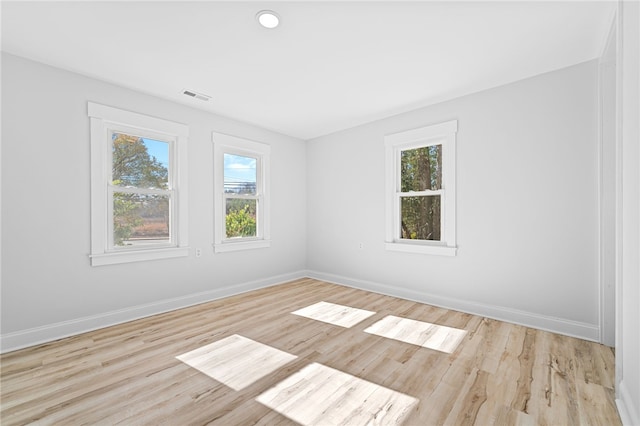 unfurnished room featuring light hardwood / wood-style floors