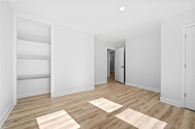 unfurnished bedroom with light hardwood / wood-style floors