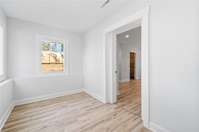 unfurnished room featuring light wood-type flooring