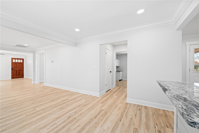 interior space with ornamental molding and light wood-type flooring