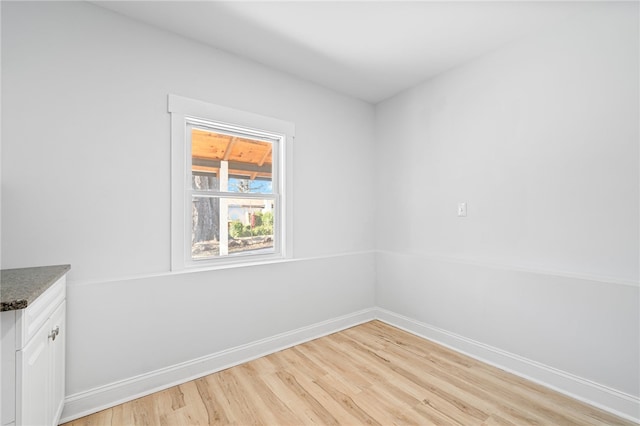 unfurnished room with light hardwood / wood-style flooring