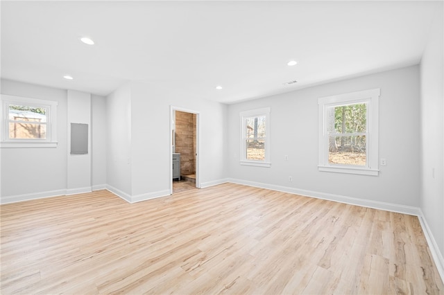 spare room with light hardwood / wood-style flooring