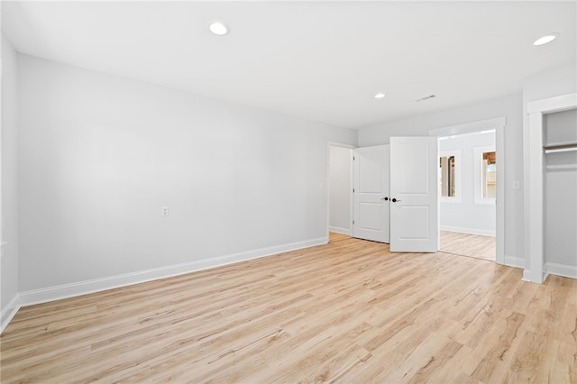 unfurnished bedroom with light wood-type flooring