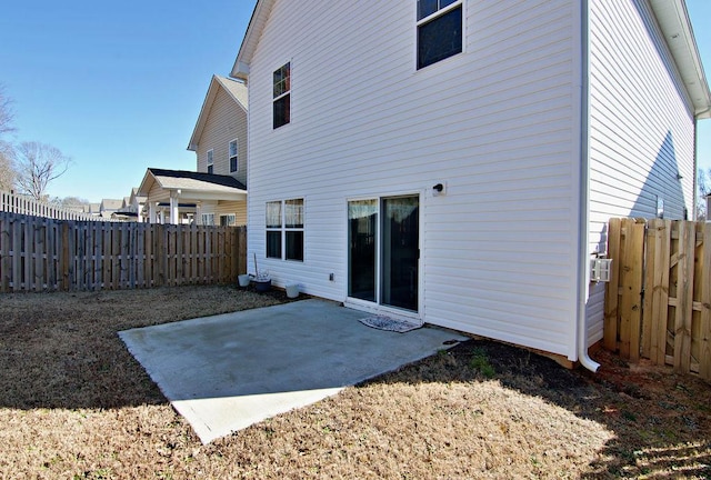 back of property featuring a patio