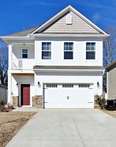 view of front of house with a balcony and a garage