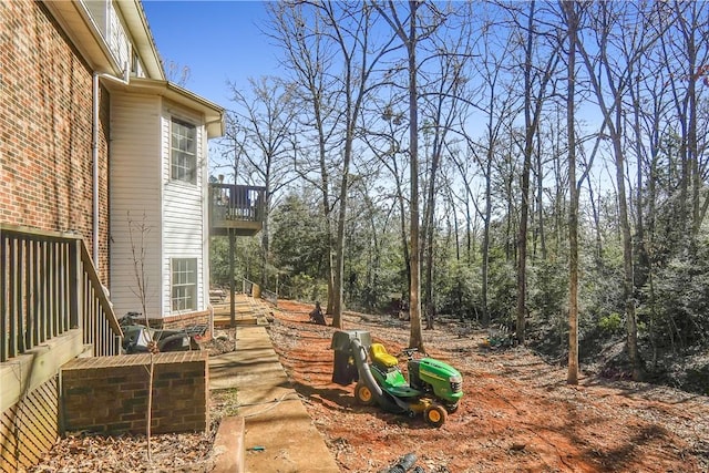 view of yard featuring a balcony