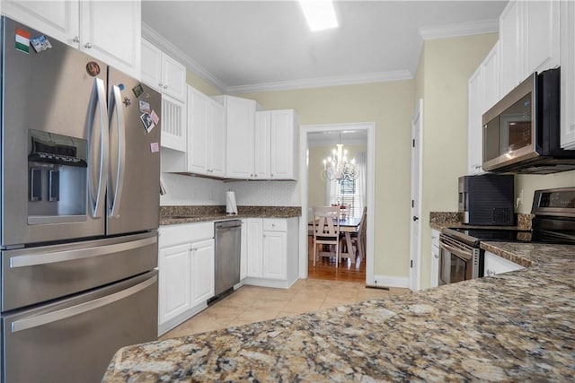 kitchen featuring ornamental molding, appliances with stainless steel finishes, light tile patterned floors, and white cabinets