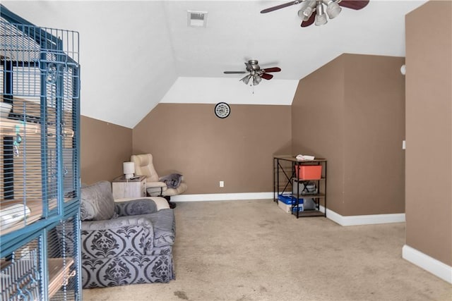 sitting room with light carpet, vaulted ceiling, and ceiling fan