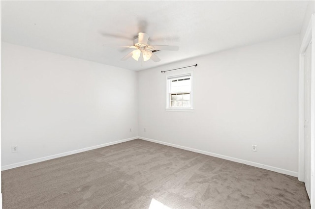 carpeted empty room with ceiling fan